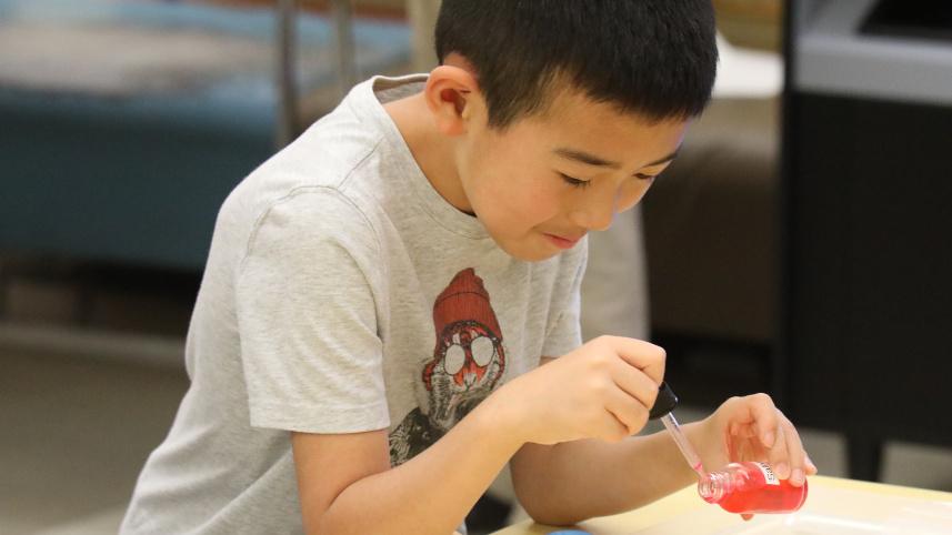 A boy experimenting